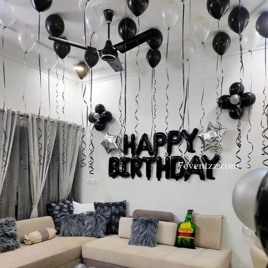 Simple balloon decoration setup with colorful balloons for home birthday party