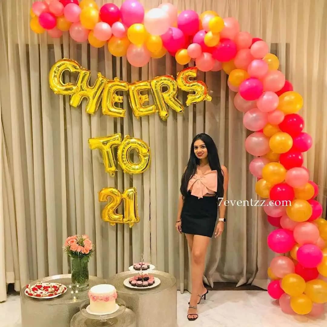 21st birthday balloon arch decoration with number balloons and colorful arrangement