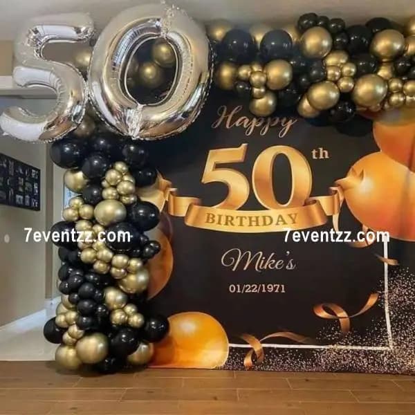 Customised 50th birthday balloon decoration with milestone themed backdrop