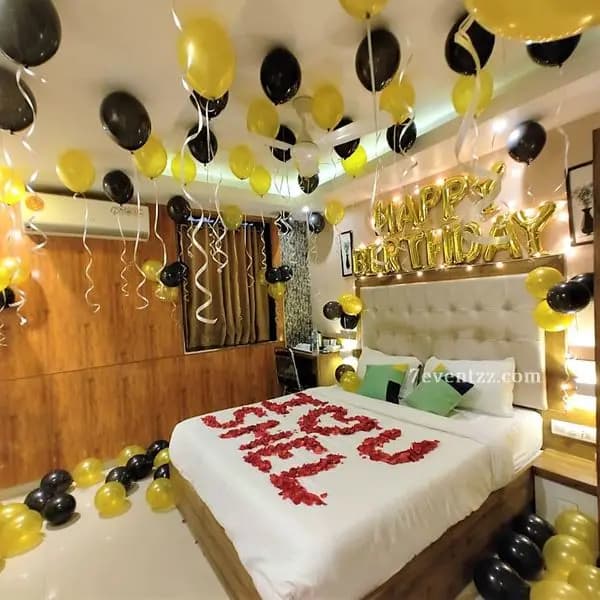 Birthday room setup with balloons and celebration decor