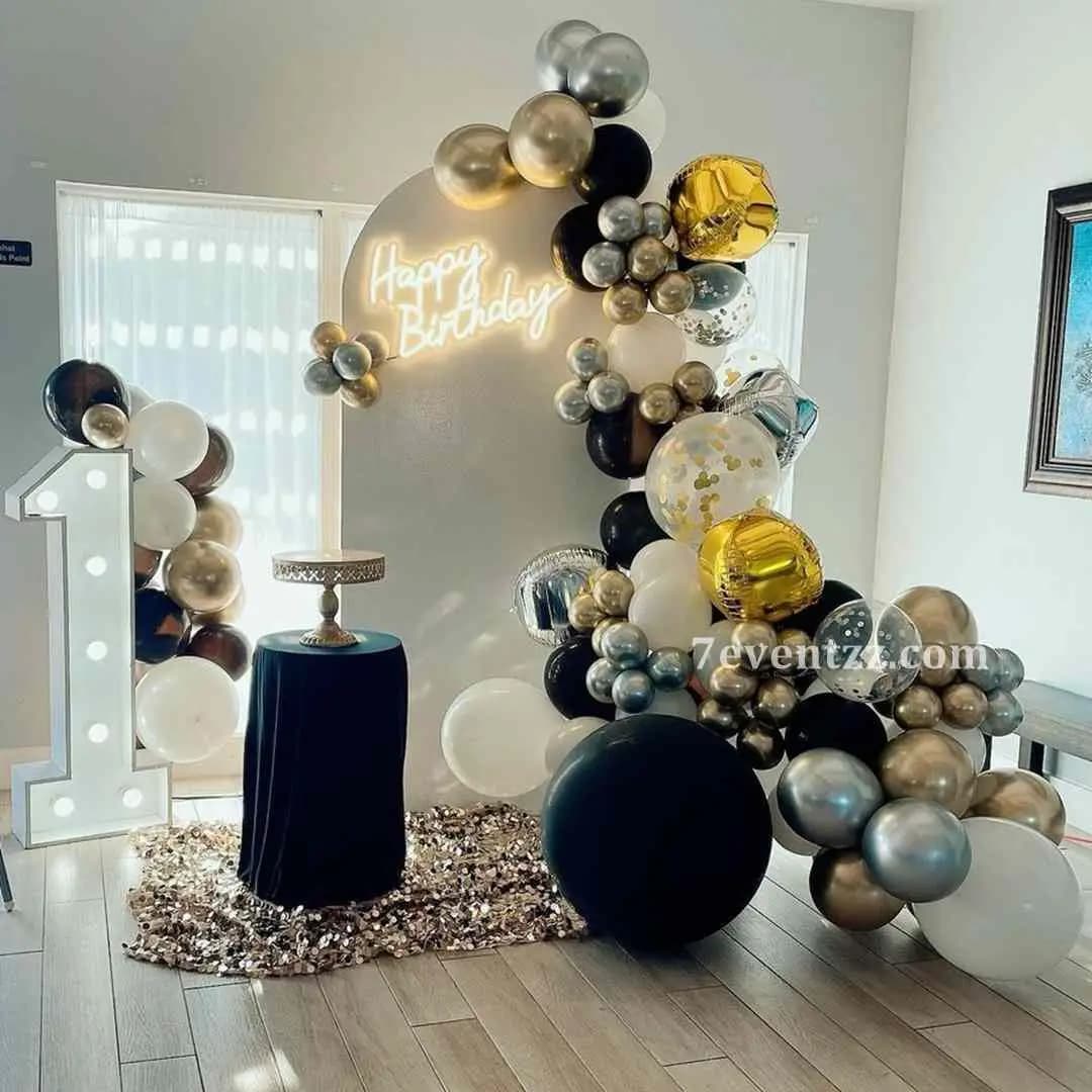 Fully customised birthday decoration with personalized backdrop, balloon columns, and themed props