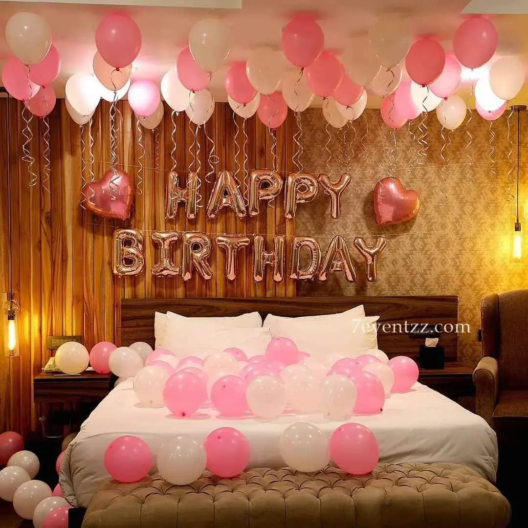 Surprise room decoration with colorful balloons, LED lights, and birthday backdrop