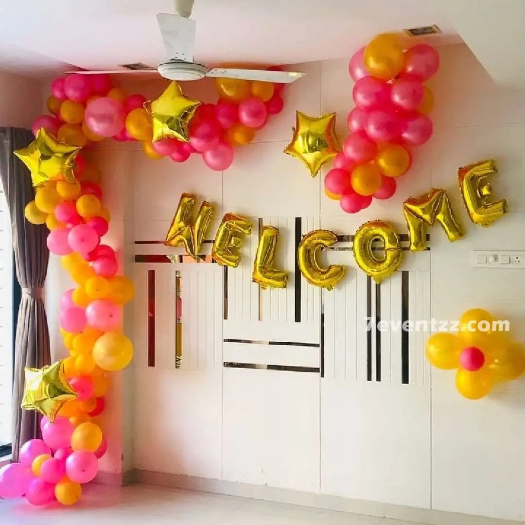 Newborn baby welcome balloon arch decoration at home entrance with multicolor balloon arrangement