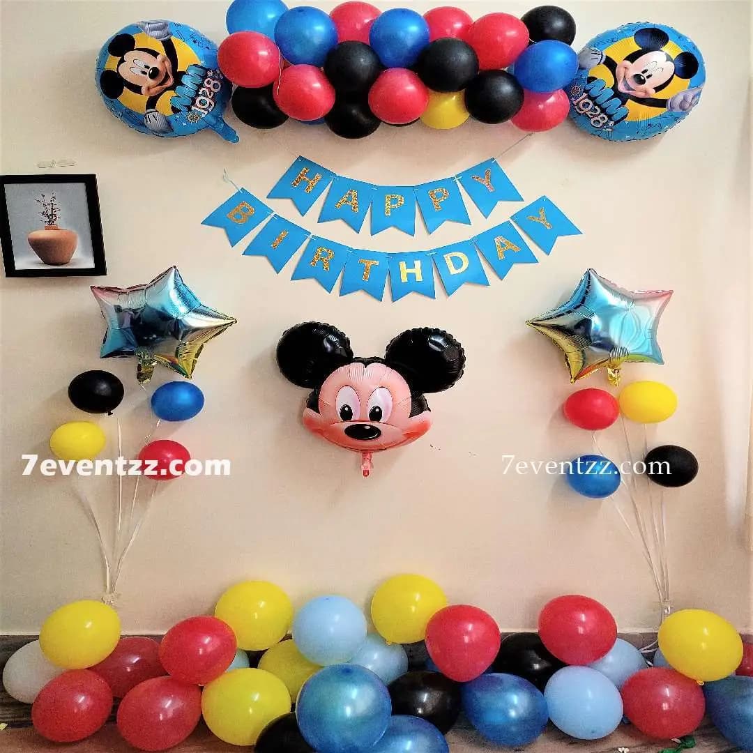 Mickey Mouse themed kids birthday decoration with character balloons and colourful setup