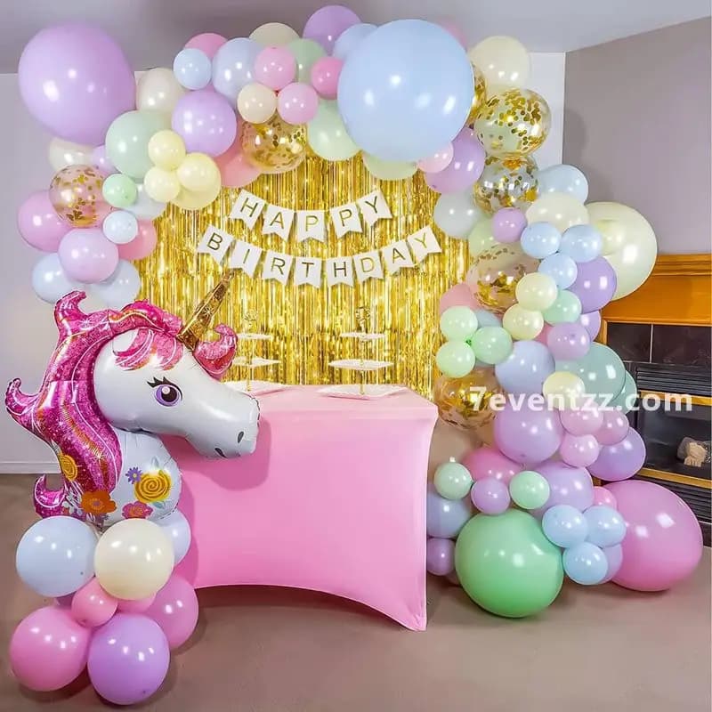 Unicorn themed wall balloon arch in pastel colors for kids birthday party