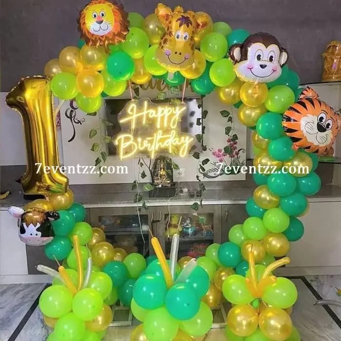 Wild animal theme birthday decoration with jungle foliage and animal character balloons