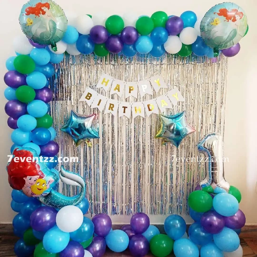Mermaid theme birthday decoration with pastel balloons, sea shell props, and underwater elements for kids by 7eventzz