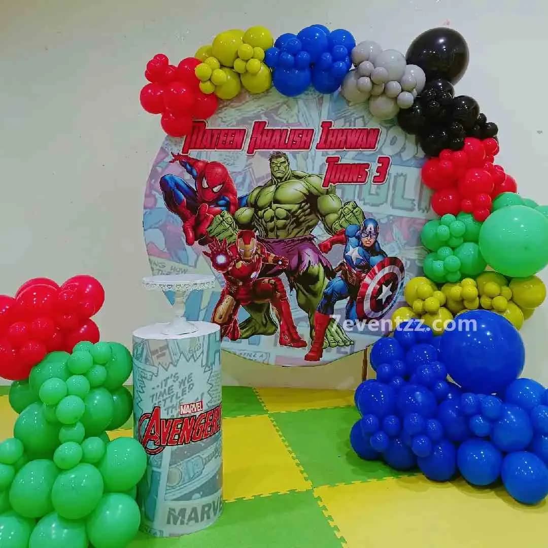 Avengers theme stage decoration with balloon arch and themed backdrop for kids birthday party by 7eventzz