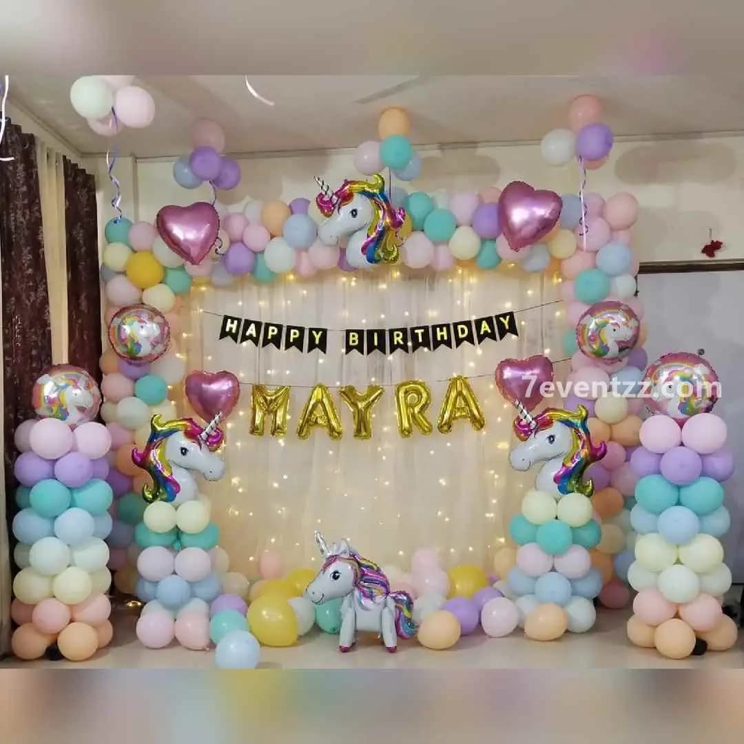 Unicorn backdrop decoration with large balloon arrangement and unicorn foil balloon for birthday party