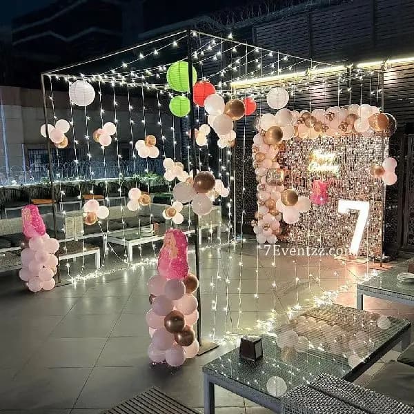 Premium Barbie theme terrace birthday decoration with pink balloons, Barbie cutouts, and festive backdrop – 7eventzz