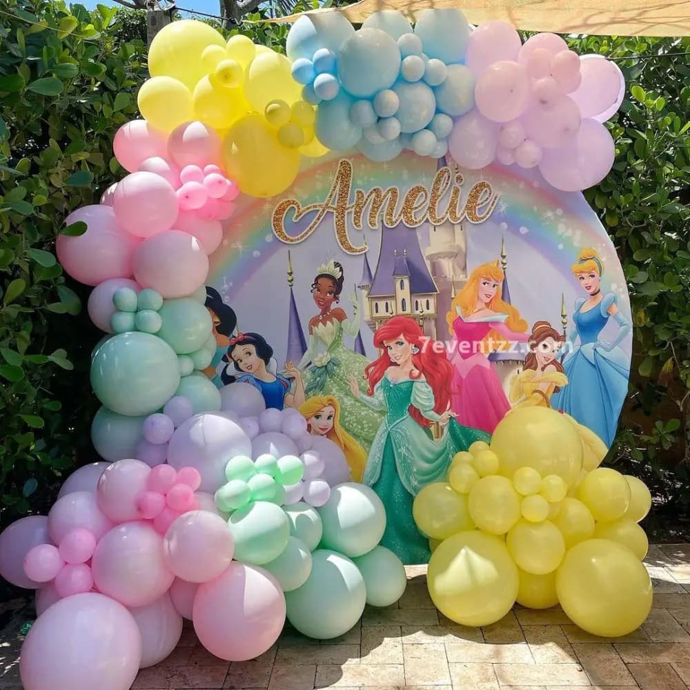 Disney Princess themed birthday decoration with beautiful backdrop, character foils, and pink balloon arrangement