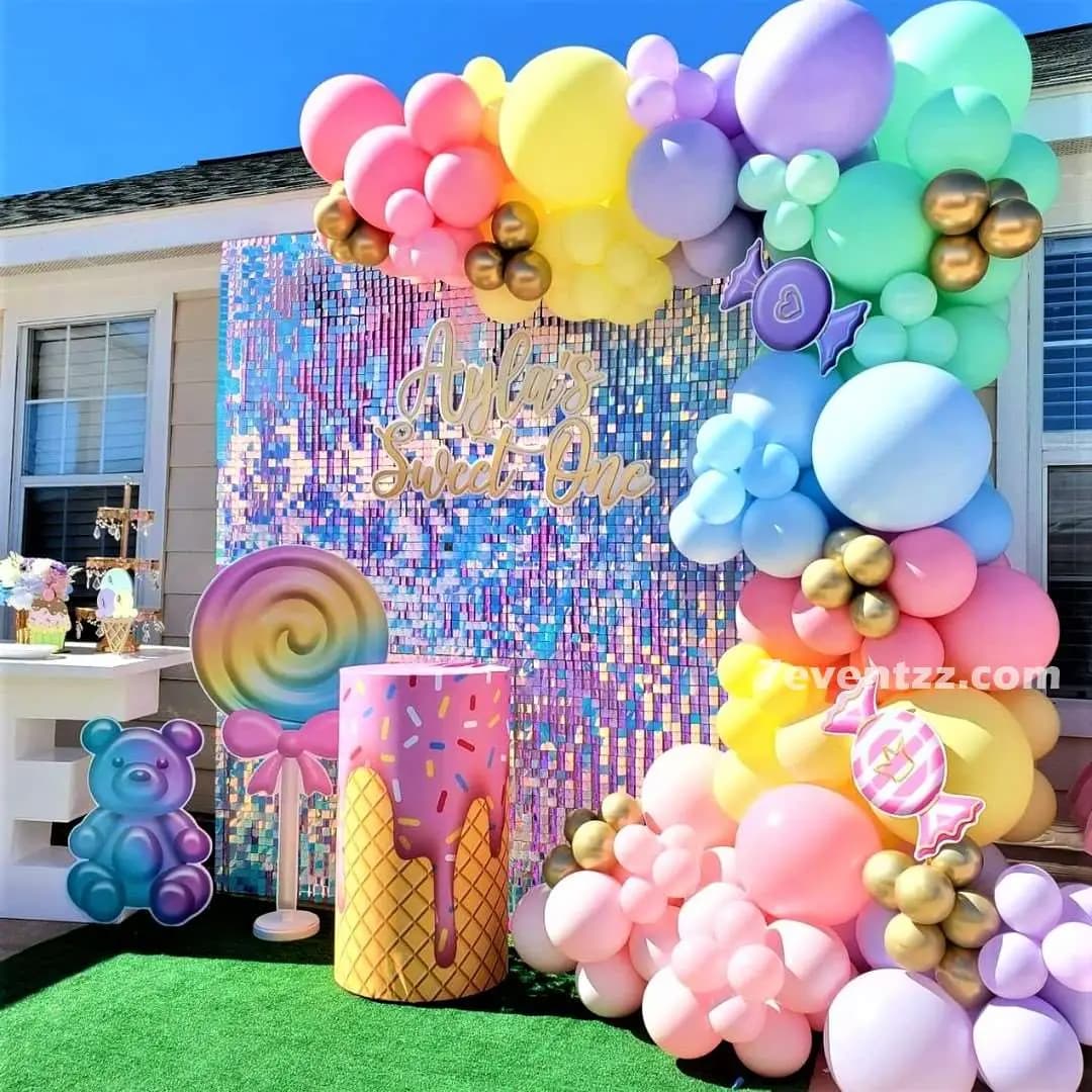 Colourful candy theme stage decoration with bright balloon arrangements