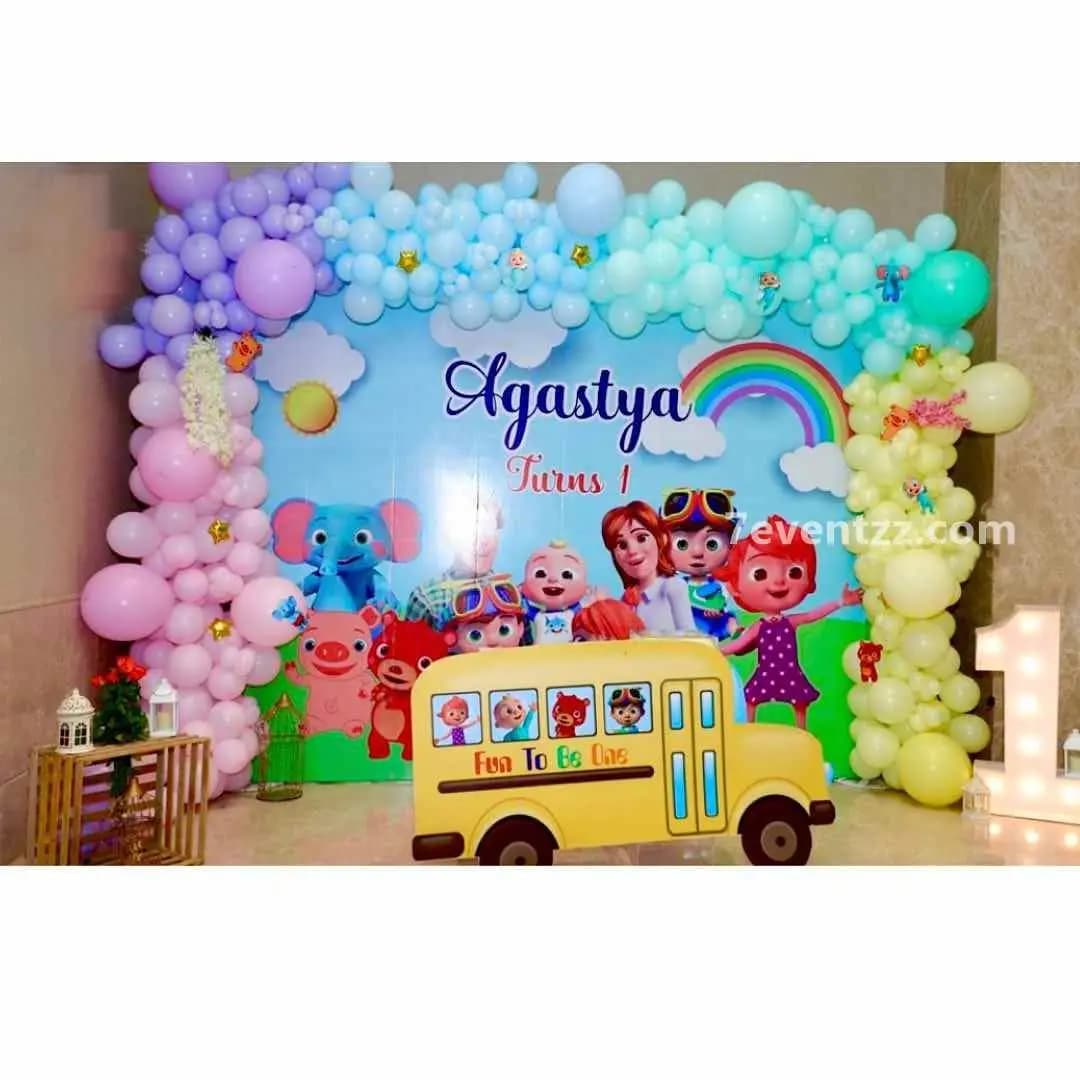 Customized Cocomelon theme birthday decoration with personalized name banner and themed balloon arrangement