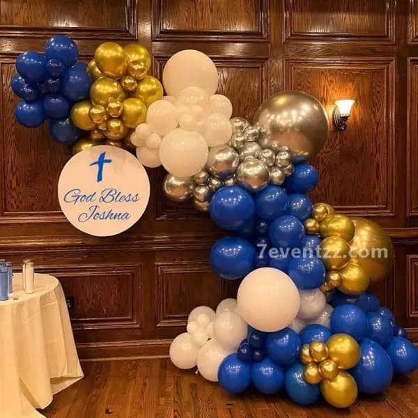 Beautiful arch decoration for baptism ceremony with white and gold theme