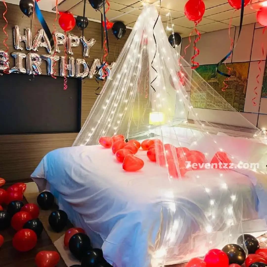 Cabana-style room decoration with fabric draping and balloons