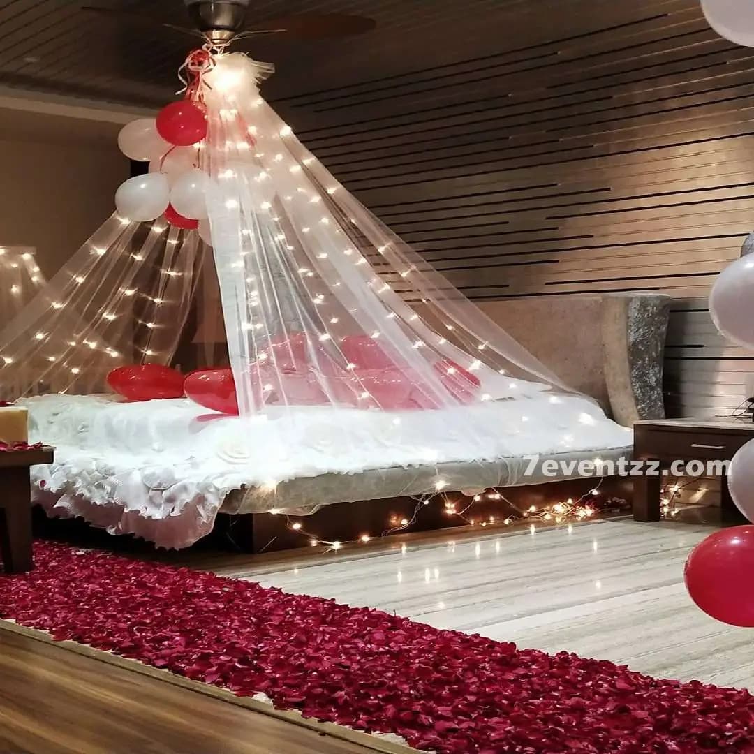 Room decoration with fresh flowers, canopy draping, and warm lights