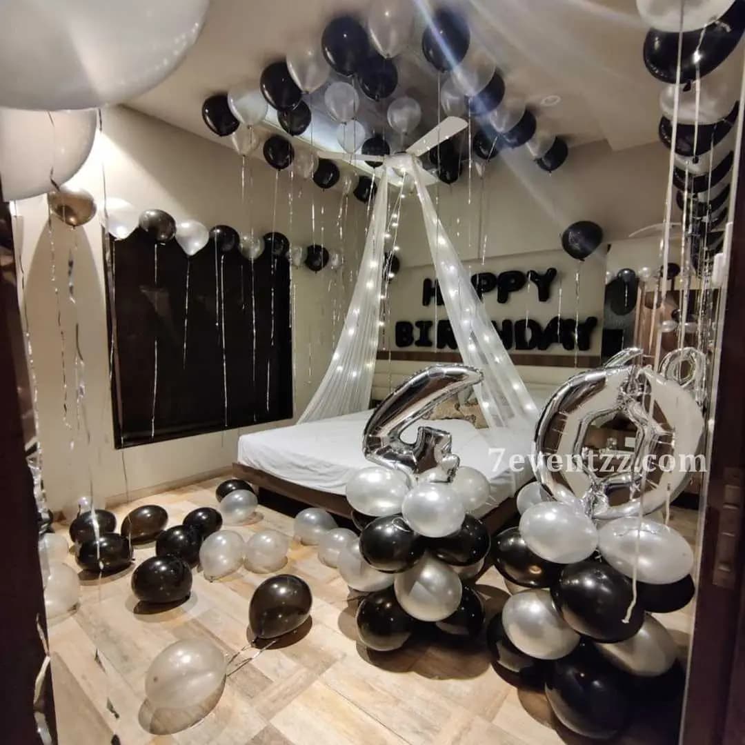 Classy cabana décor with beautiful draping, subtle colors, and balloon accents