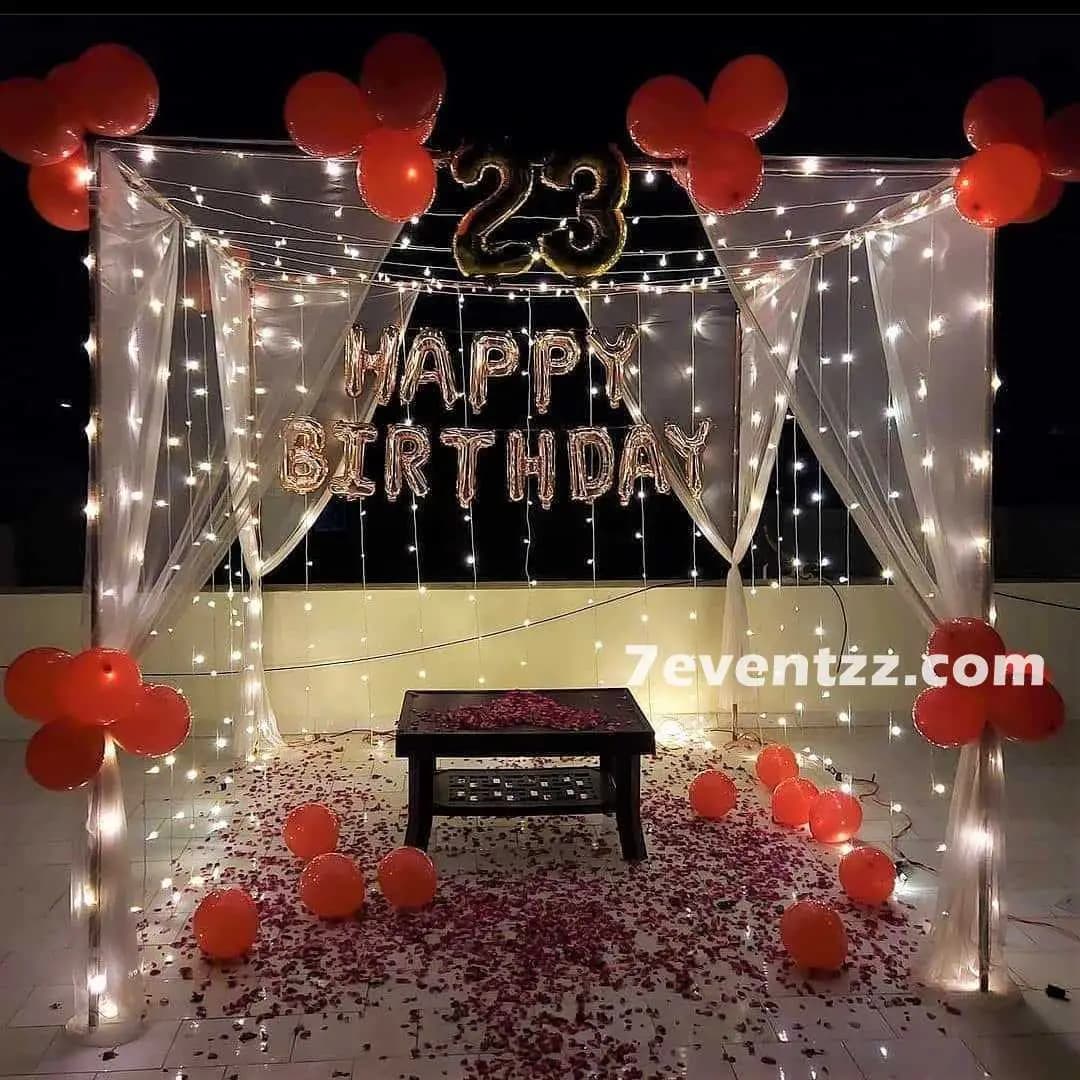 Simple rooftop terrace decoration with balloons and string lights for budget-friendly outdoor birthday party – 7eventzz