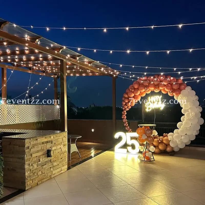 Terrace light decoration setup with warm string lights and fairy light canopy for outdoor evening celebration – 7eventzz