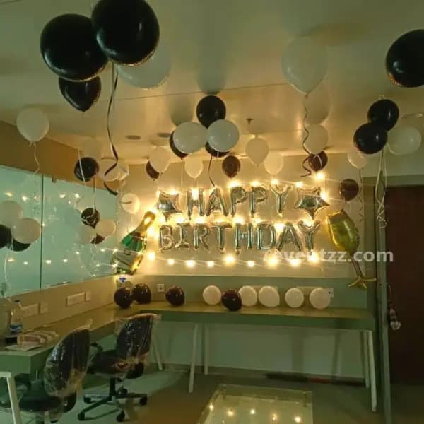 Boss Baby themed birthday decoration with character props and blue balloon arrangement at home