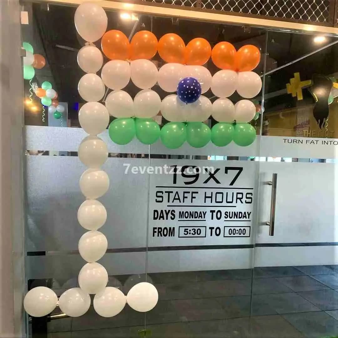Tricolour Republic Day decoration setup for office with Indian flag-themed balloons and backdrop