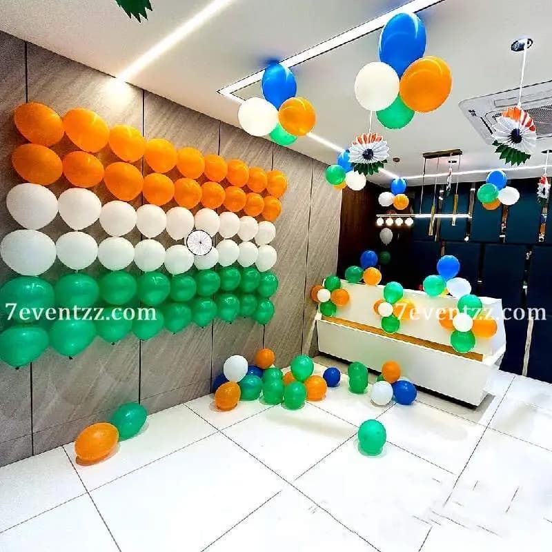 Office decorated for Independence Day with tricolour balloons, flags, and patriotic banner