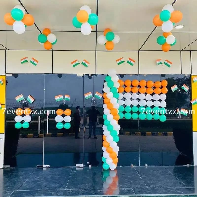 Independence Day balloon decoration with orange, white, and green balloons in office