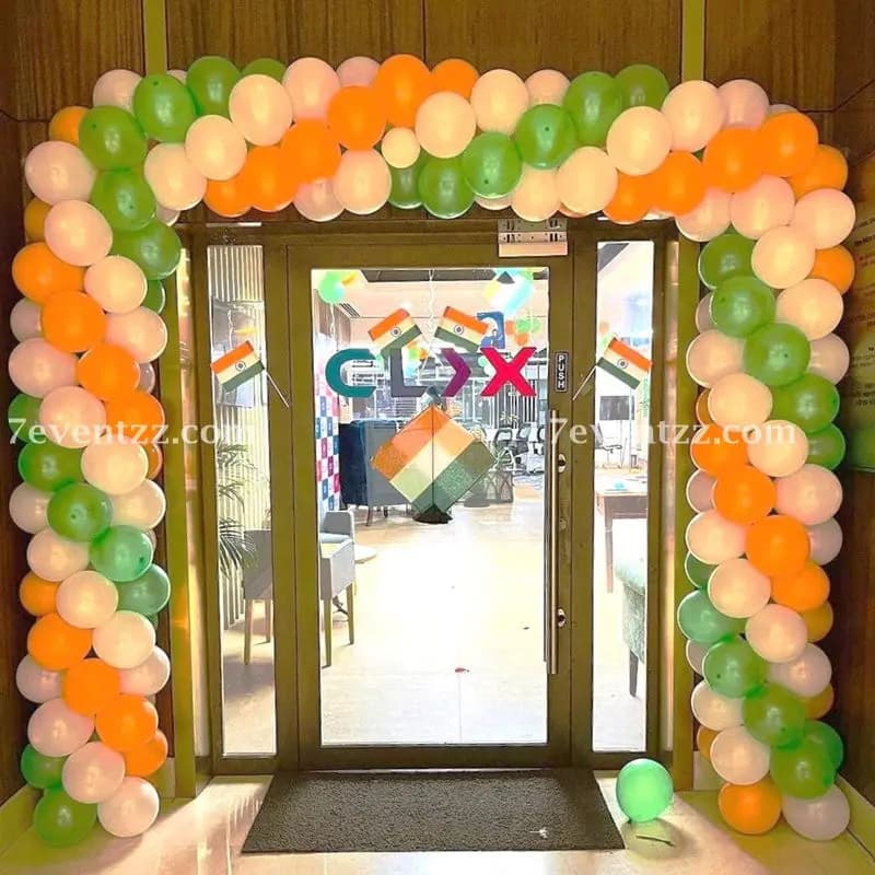 Republic Day decoration at office entrance with tricolour balloons and national flag backdrop
