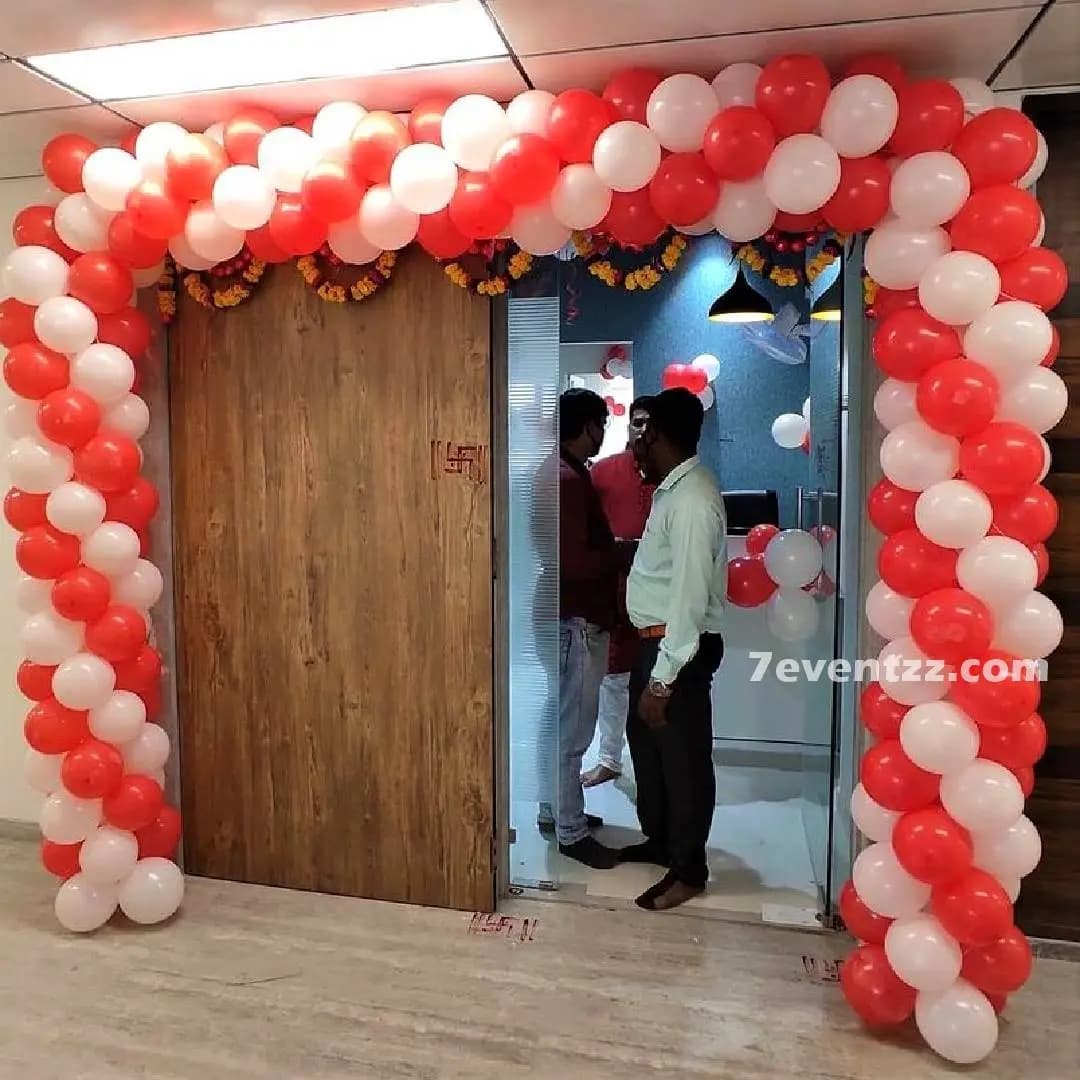 Colourful balloon gate arch at office entrance for corporate event