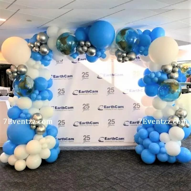 Corporate event decoration with branded backdrop and balloon display