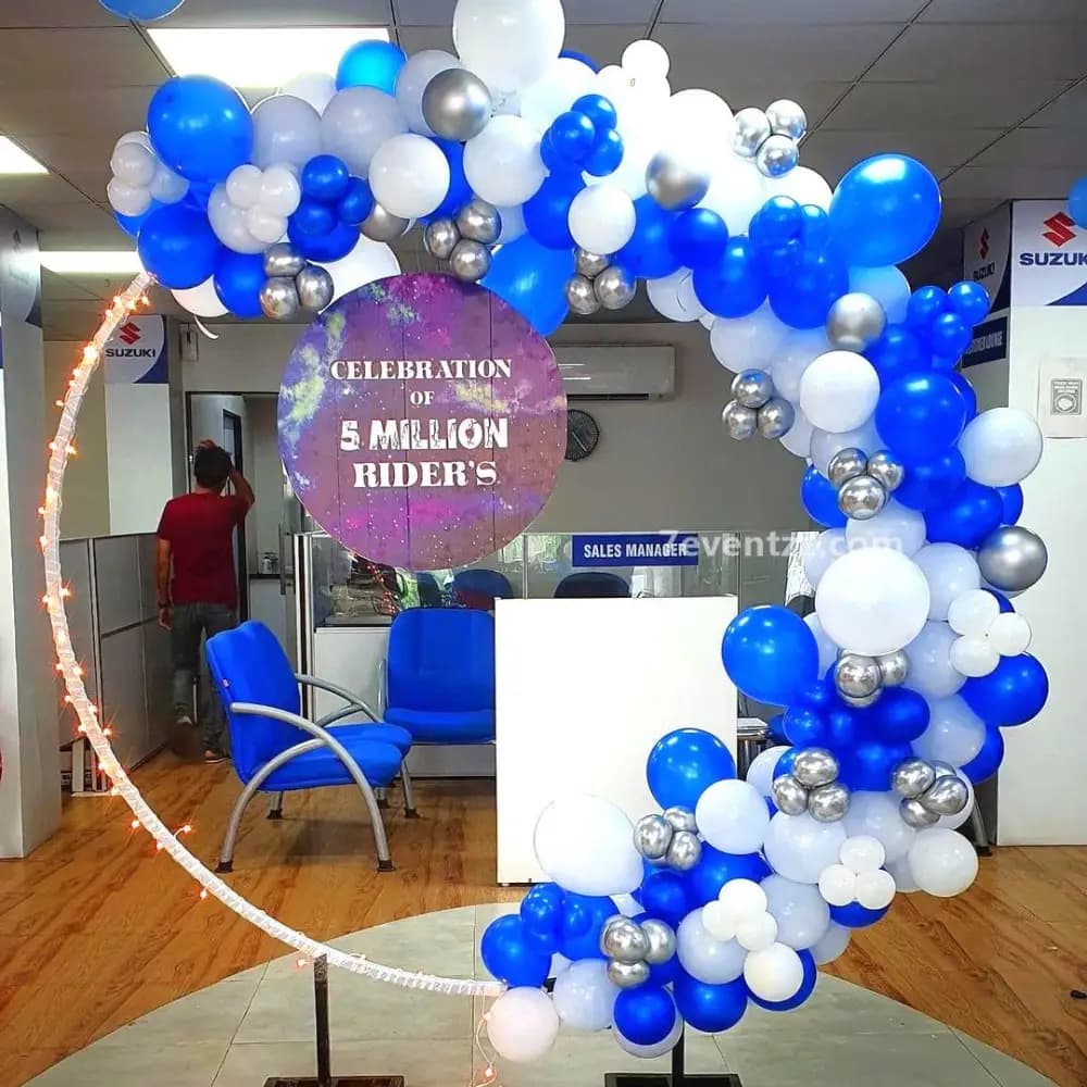 Office celebration decoration with balloon arch and festive backdrop