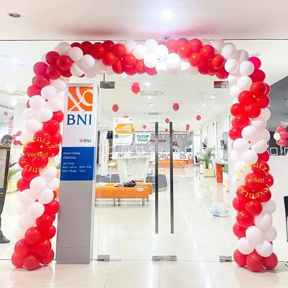 Simple office anniversary decoration with balloons and celebratory banner