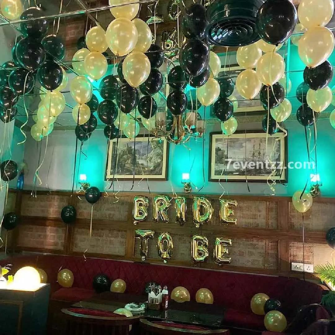 Simple bride-to-be balloon and banner setup for home party