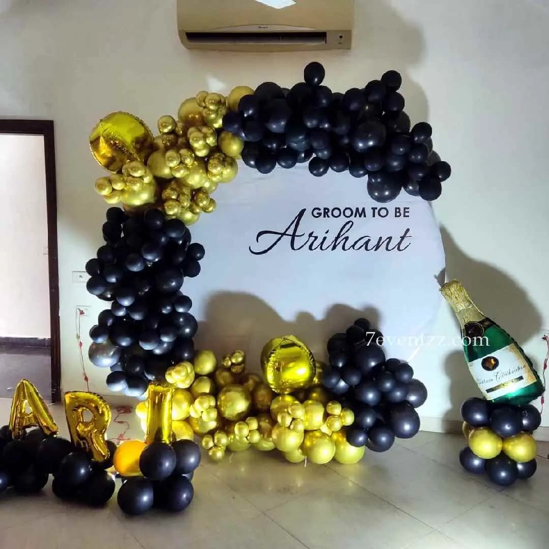 Groom-to-be themed balloon and backdrop party decoration