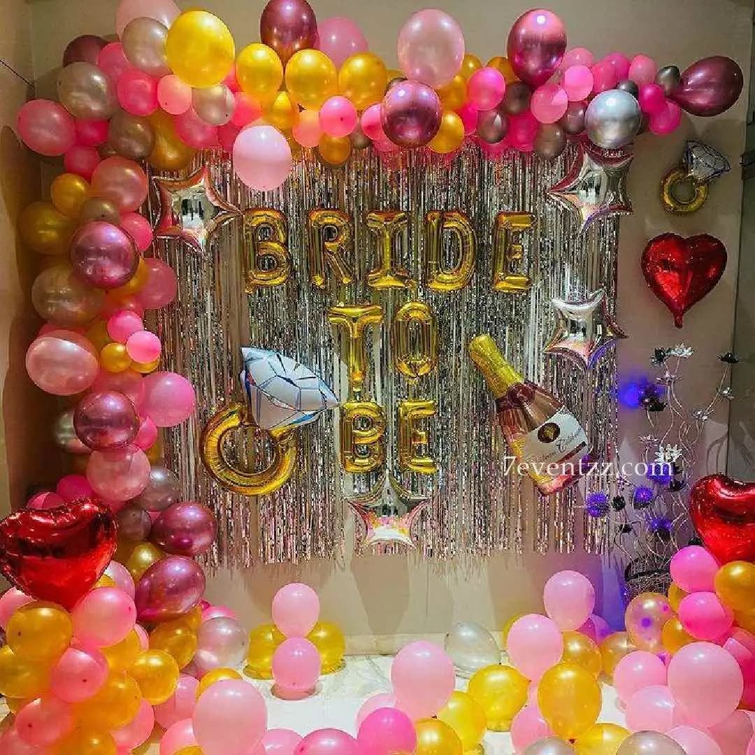 Bridal shower decoration with pastel balloons and banner