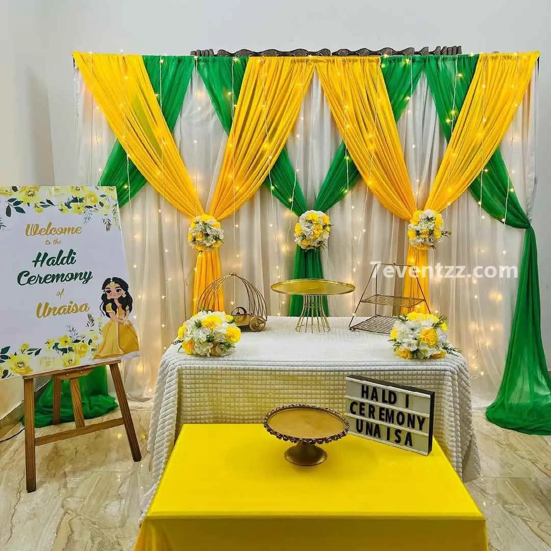 Haldi decoration with warm fairy lights and floral accents