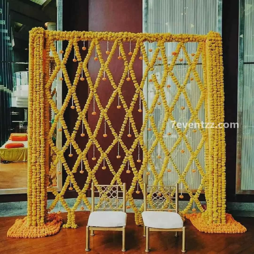 Traditional haldi decoration with bright marigold flowers