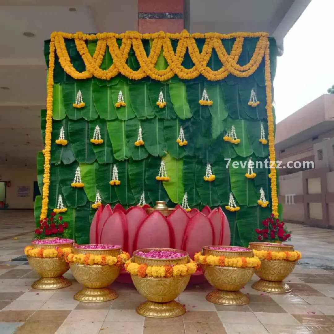 Haldi backdrop decoration using banana leaves and fresh flowers