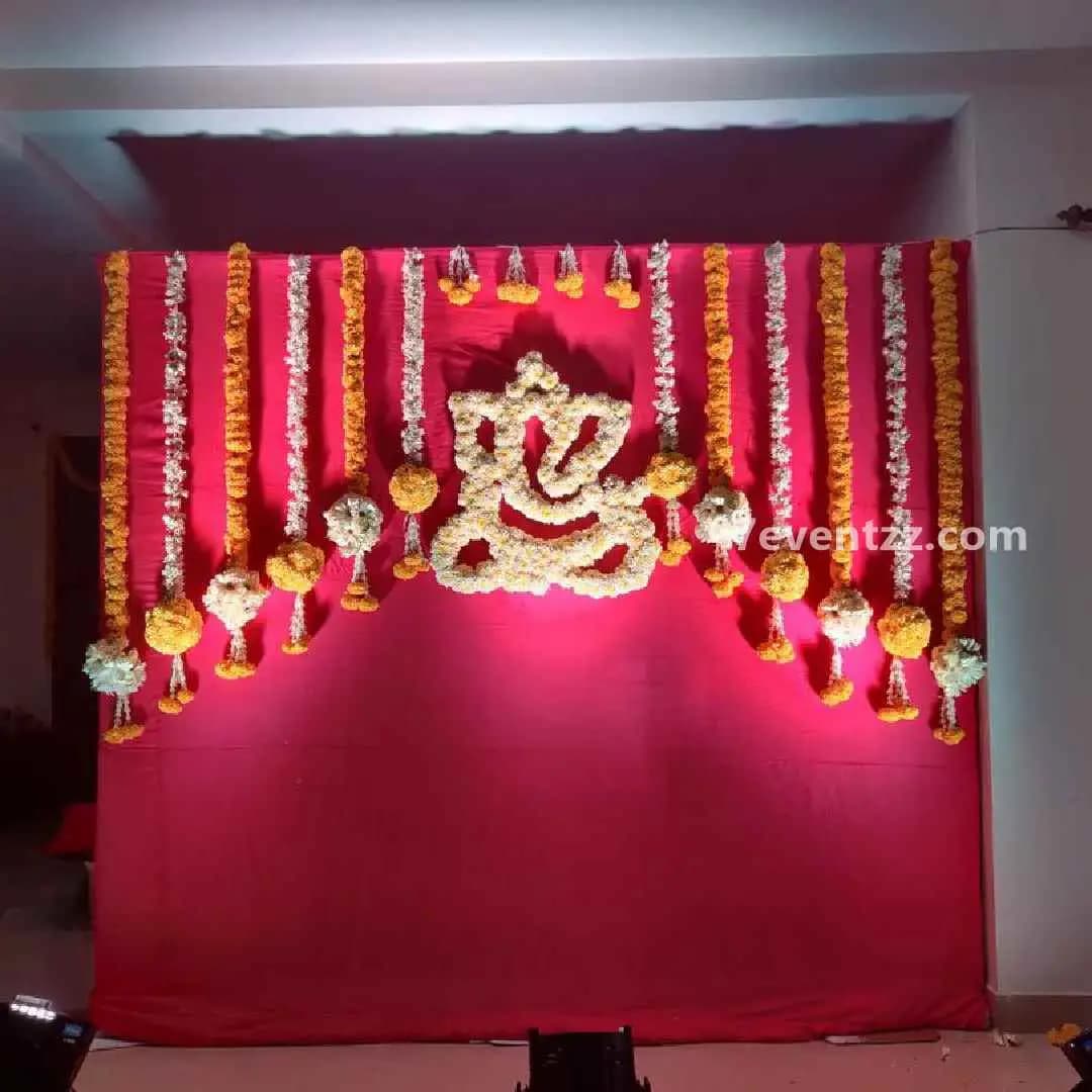 Decorative mehndi backdrop design with flowers and artistic elements