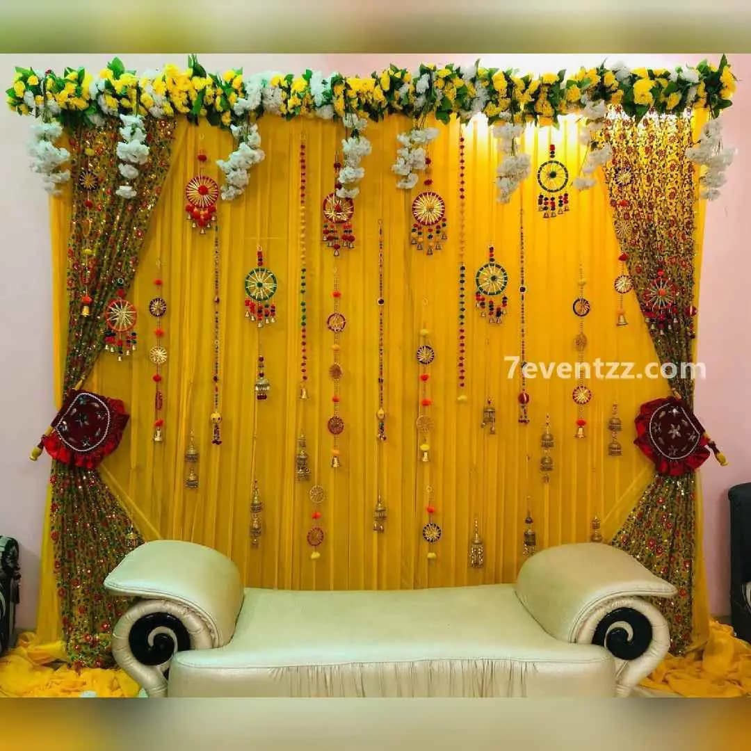Elegant mehndi decoration with floral arrangements at home
