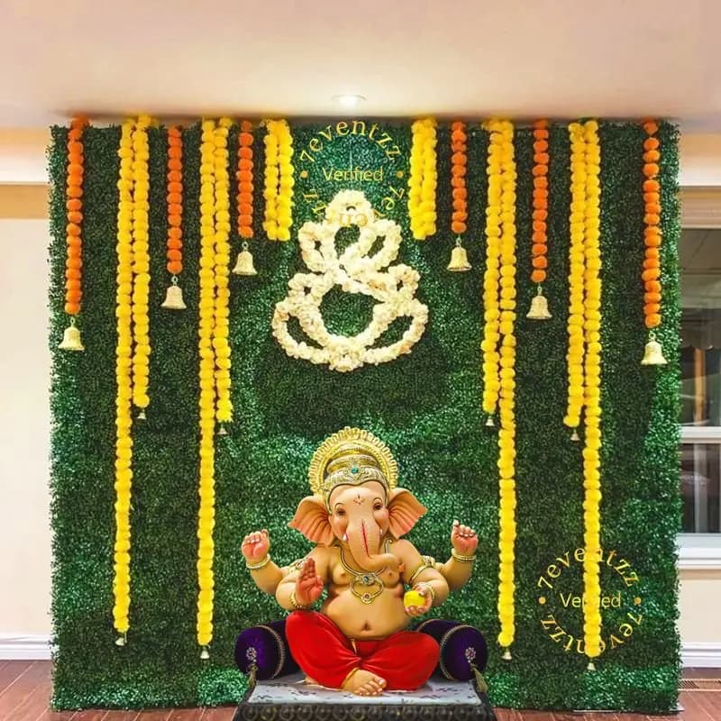 Colorful Ganesh Chaturthi decoration with flowers and traditional elements