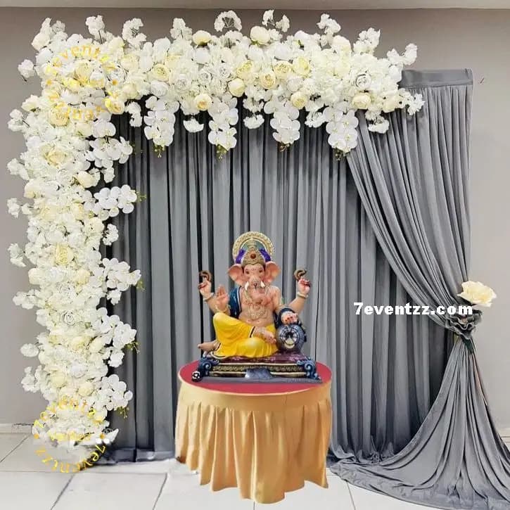 Floral and themed background decoration setup for Ganpati idol