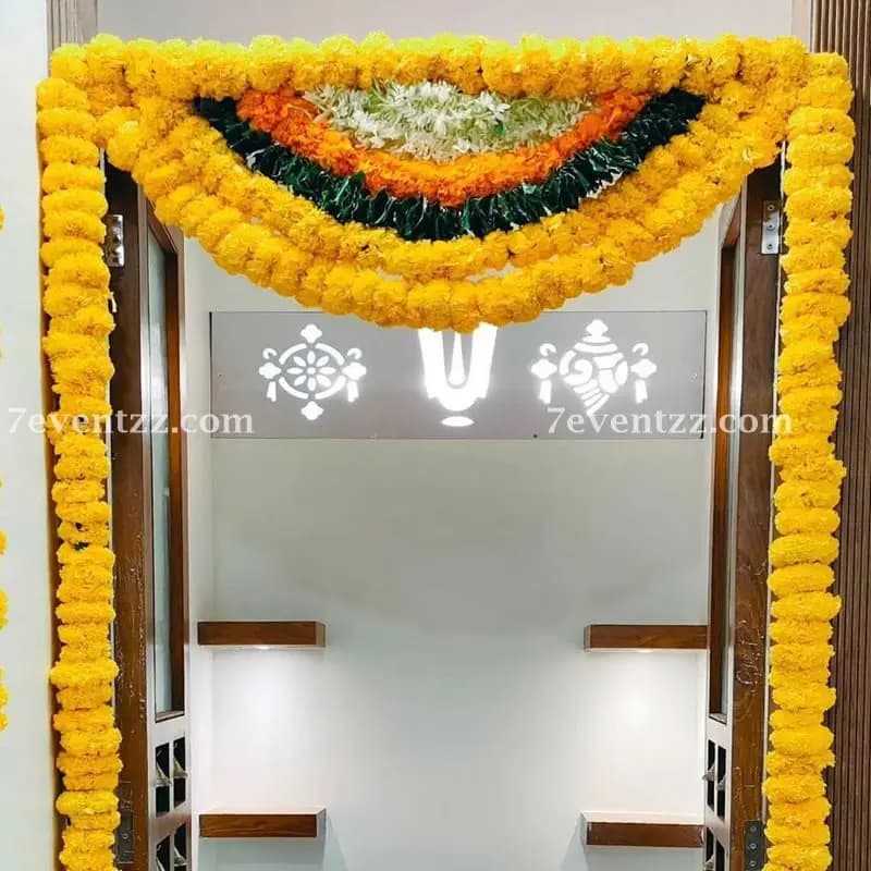 Traditional home mandir decorated with fresh flower arrangements
