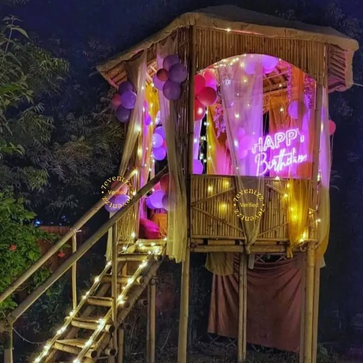 Couple's private candle light dinner inside a decorated tree house