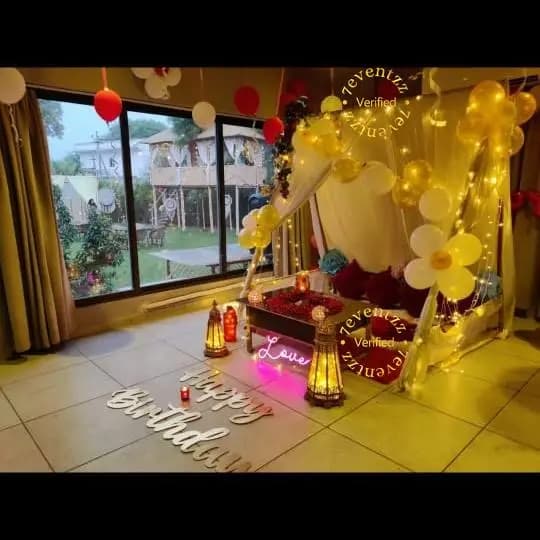 Beautiful outdoor cabana dinner setup with decorative lighting