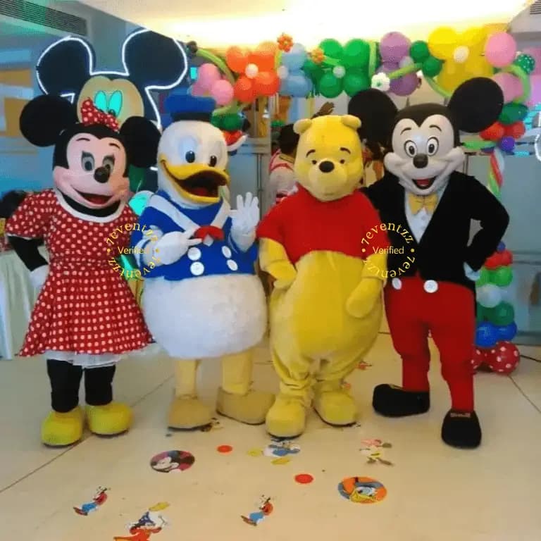 Costumed mascot character entertaining children at a birthday celebration