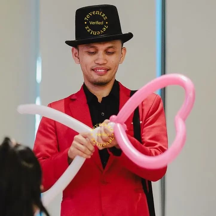 Balloon sculpture artist creating animal and character shapes for kids